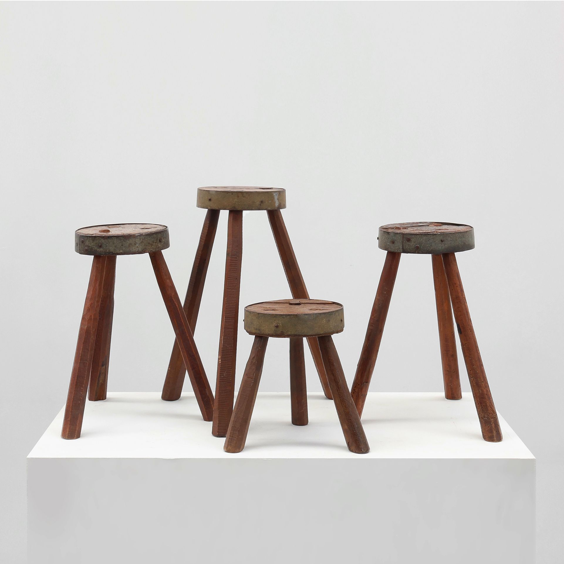 Brutalist French 1850s solid oak tripod stools with metal rim, set of 4-img